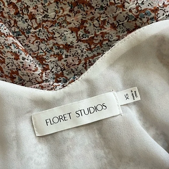 FLORET STUDIOS | Cold Shoulder Asymmetric Ruffle Dress In Rust-Cream | Size XS - Picture 8 of 10